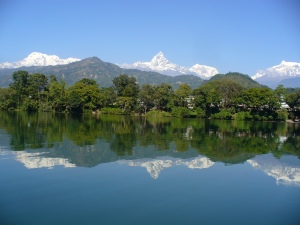 The Himalayas rise over Phewa Lake in Pokhara.